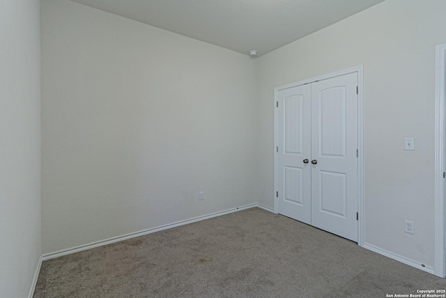 2733 Barkey Spg, San Antonio, TX 78245 - unfurnished bedroom featuring carpet flooring, baseboards, and a closet