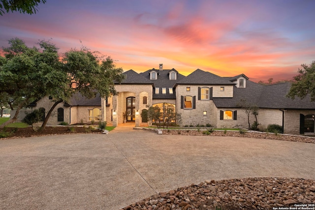 113 Carino Cv, Boerne, TX 78006 - french country inspired facade featuring stone siding and a chimney
