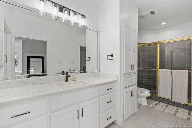 113 Carino Cv, Boerne, TX 78006 - full bath with toilet, a stall shower, tile patterned floors, vanity, and recessed lighting
