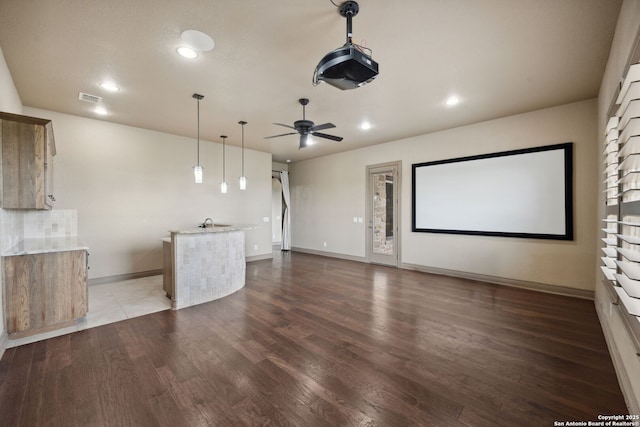 1078 Star Rdg, Spring Branch, TX 78070 - home theater room featuring wood finished floors, ceiling fan, recessed lighting, baseboards, and a sink