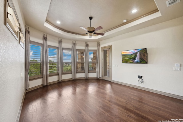 1078 Star Rdg, Spring Branch, TX 78070 - unfurnished room with a tray ceiling, baseboards, wood finished floors, a ceiling fan, and recessed lighting