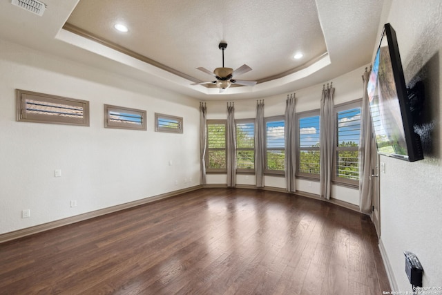 1078 Star Rdg, Spring Branch, TX 78070 - empty room featuring a tray ceiling, ceiling fan, baseboards, wood finished floors, and a textured ceiling