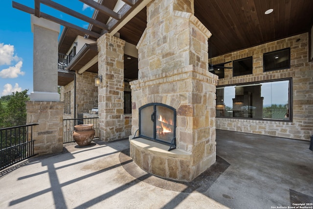 1078 Star Rdg, Spring Branch, TX 78070 - view of patio / terrace with an outdoor stone fireplace