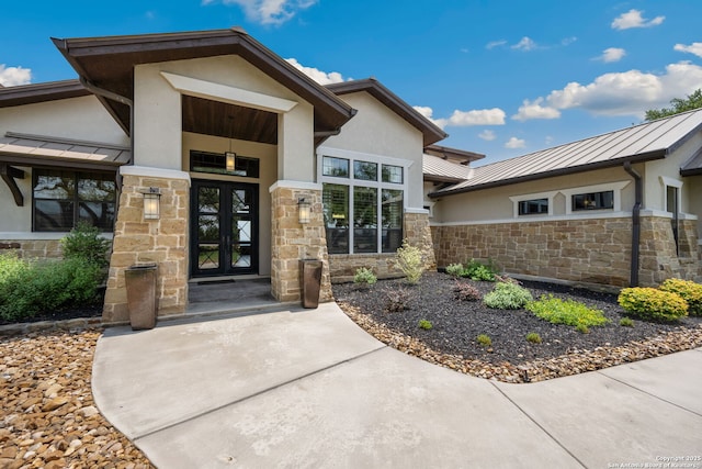 1078 Star Rdg, Spring Branch, TX 78070 - doorway to property featuring a standing seam roof, stucco siding, stone siding, and french doors