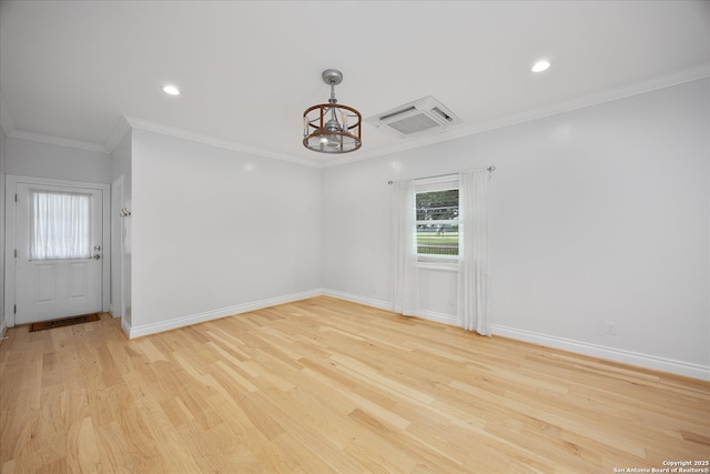 29729 Mellow Wind, Fair Oaks Ranch, TX 78015 - spare room with a chandelier, light wood-style floors, baseboards, ornamental molding, and recessed lighting