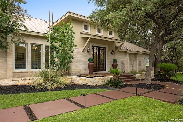 29729 Mellow Wind, Fair Oaks Ranch, TX 78015 - view of front facade with a standing seam roof, metal roof, a front yard, and brick siding