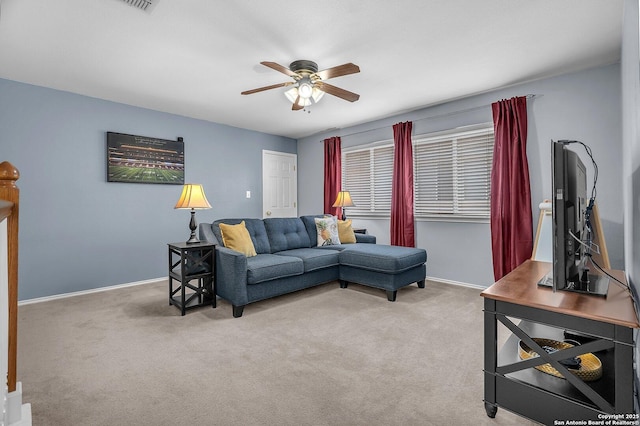 7715 Beechnut Oak, San Antonio, TX 78223 - living area with a ceiling fan, light carpet, and baseboards