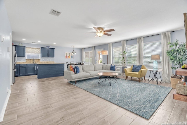 7715 Beechnut Oak, San Antonio, TX 78223 - living room with ceiling fan, light wood-style flooring, plenty of natural light, and recessed lighting