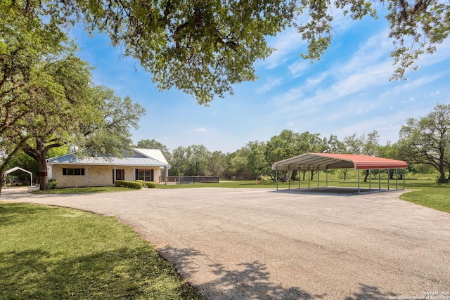 838 Georg Oaks, Bulverde, TX 78163 - view of front of property with a front yard, a detached carport, asphalt driveway, and metal roof