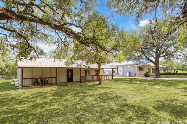 838 Georg Oaks, Bulverde, TX 78163 - back of house featuring covered porch, a yard, and metal roof