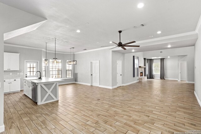 838 Georg Oaks, Bulverde, TX 78163 - unfurnished living room featuring recessed lighting, a sink, light wood finished floors, baseboards, and healthy amount of natural light