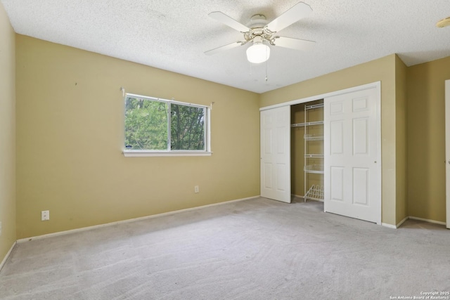 15527 Legend Spgs, San Antonio, TX 78247 - unfurnished bedroom with carpet flooring, a closet, a textured ceiling, baseboards, and ceiling fan