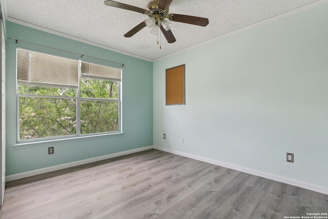 15527 Legend Spgs, San Antonio, TX 78247 - empty room with wood finished floors, a textured ceiling, baseboards, and a ceiling fan