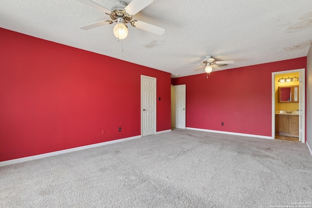 15527 Legend Spgs, San Antonio, TX 78247 - empty room with ceiling fan, carpet flooring, a textured ceiling, and baseboards
