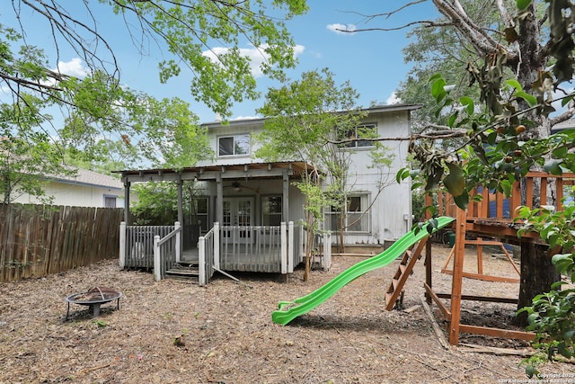 15527 Legend Spgs, San Antonio, TX 78247 - back of property featuring a fire pit, ceiling fan, a deck, french doors, and a playground
