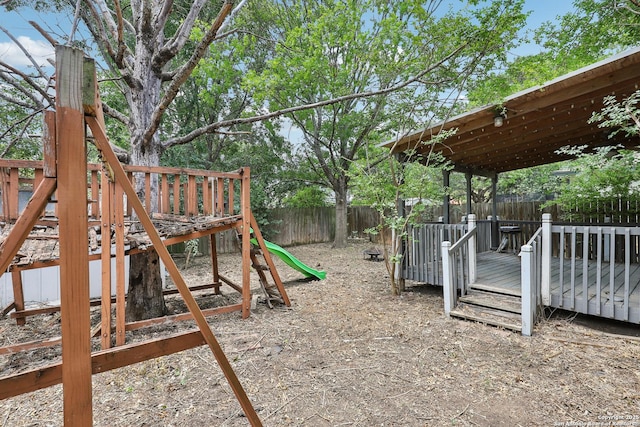 15527 Legend Spgs, San Antonio, TX 78247 - fenced backyard featuring a wooden deck and a playground