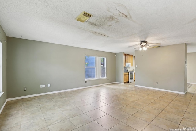 15527 Legend Spgs, San Antonio, TX 78247 - unfurnished living room with ceiling fan, a textured ceiling, light tile patterned floors, and baseboards