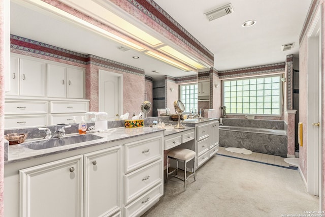 1434 Whispering Water, Spring Branch, TX 78070 - full bath with wallpapered walls, double vanity, and a garden tub