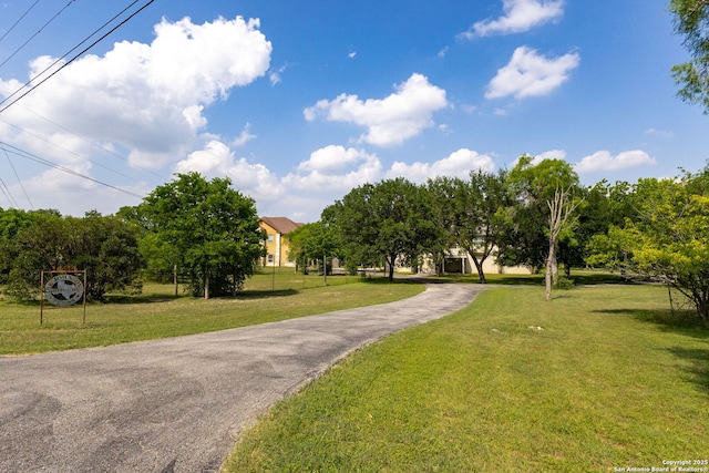 1434 Whispering Water, Spring Branch, TX 78070 - surrounding community featuring driveway and a yard