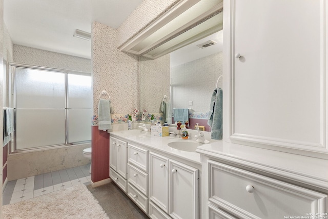 1434 Whispering Water, Spring Branch, TX 78070 - bathroom with double vanity, enclosed tub / shower combo, and toilet