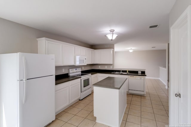 9618 Copper Fls, San Antonio, TX 78109 - kitchen with white appliances, dark countertops, light tile patterned floors, and a sink