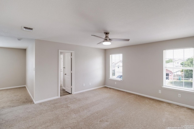 9618 Copper Fls, San Antonio, TX 78109 - carpeted spare room featuring plenty of natural light, ceiling fan, and baseboards