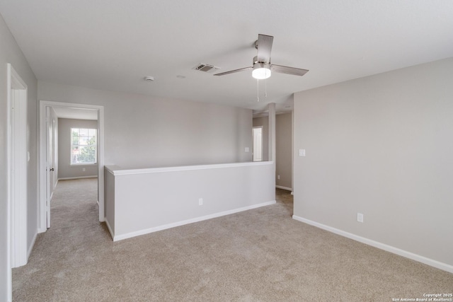 9618 Copper Fls, San Antonio, TX 78109 - unfurnished room featuring light carpet, baseboards, and a ceiling fan