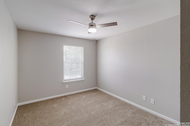 9618 Copper Fls, San Antonio, TX 78109 - spare room featuring carpet, ceiling fan, and baseboards
