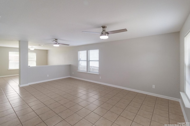 9618 Copper Fls, San Antonio, TX 78109 - spare room featuring a ceiling fan, light tile patterned flooring, and baseboards