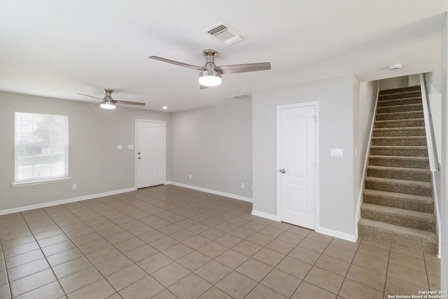9618 Copper Fls, San Antonio, TX 78109 - empty room featuring a ceiling fan, stairs, and light tile patterned floors