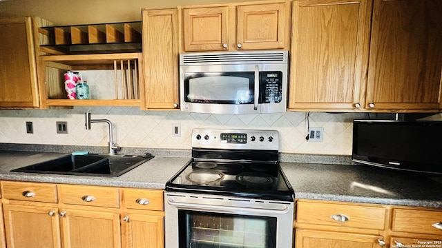 9208 Bowen, San Antonio, TX 78250 - kitchen with appliances with stainless steel finishes, a sink, backsplash, and open shelves