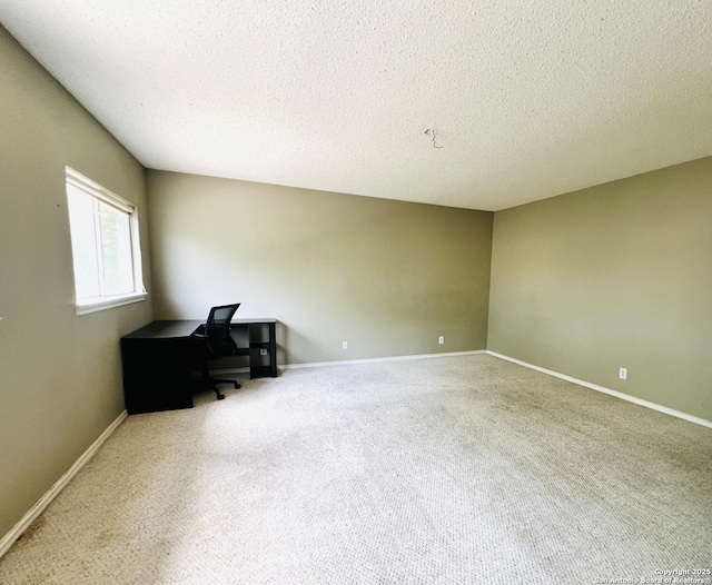 9208 Bowen, San Antonio, TX 78250 - unfurnished office featuring carpet flooring, a textured ceiling, and baseboards