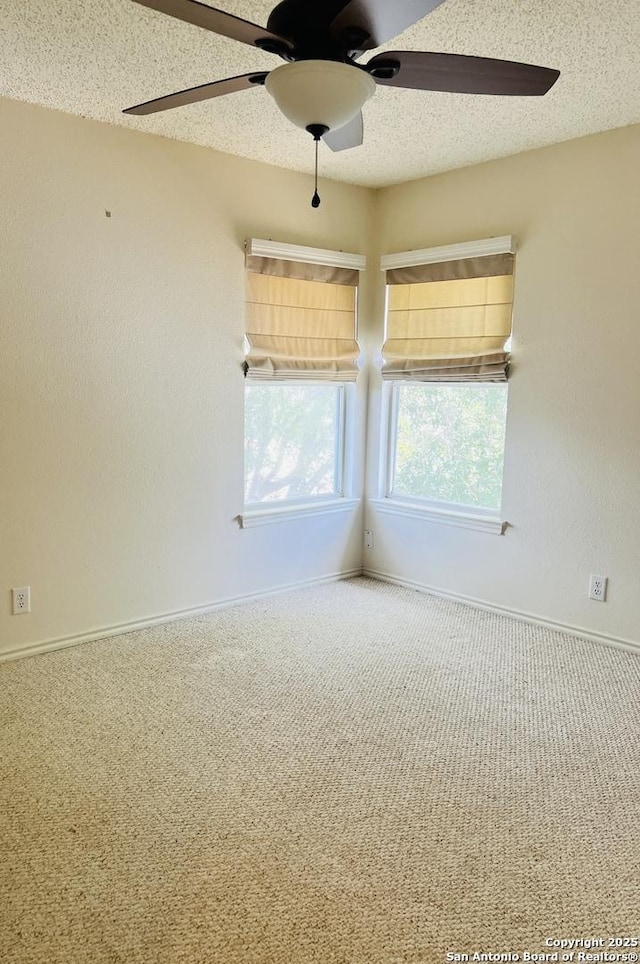 9208 Bowen, San Antonio, TX 78250 - empty room with carpet floors, a ceiling fan, a textured ceiling, and baseboards