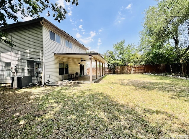 9208 Bowen, San Antonio, TX 78250 - back of property with ceiling fan, a patio area, and cooling unit