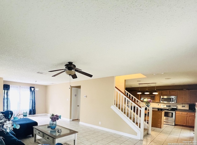 9208 Bowen, San Antonio, TX 78250 - living room featuring stairway, a textured ceiling, light tile patterned floors, ceiling fan, and baseboards