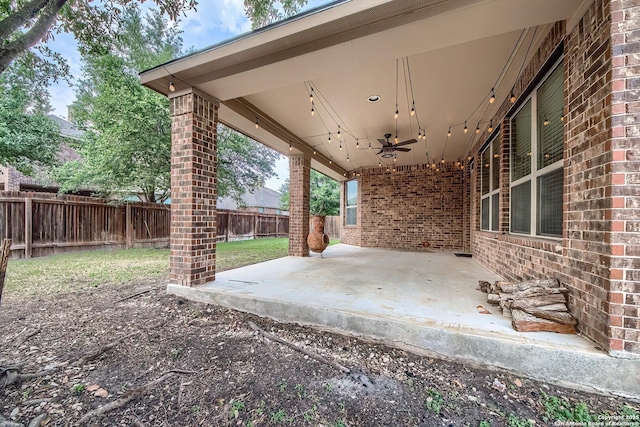 3811 Mira Mesa, San Antonio, TX 78259 - fenced backyard with ceiling fan and a patio area