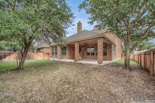 3811 Mira Mesa, San Antonio, TX 78259 - back of property featuring brick siding, a ceiling fan, a chimney, and a patio area