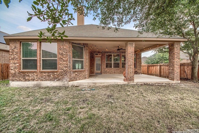 3811 Mira Mesa, San Antonio, TX 78259 - back of house featuring a ceiling fan, brick siding, a patio area, a chimney, and roof with shingles