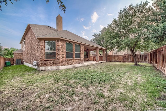3811 Mira Mesa, San Antonio, TX 78259 - rear view of property featuring brick siding, a chimney, a patio area, cooling unit, and roof with shingles