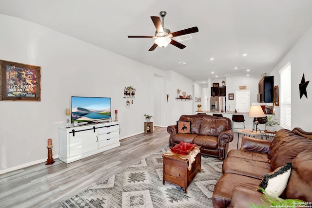 11706 Troubadour Trl, San Antonio, TX 78245 - living area featuring light wood-type flooring, a ceiling fan, recessed lighting, lofted ceiling, and baseboards