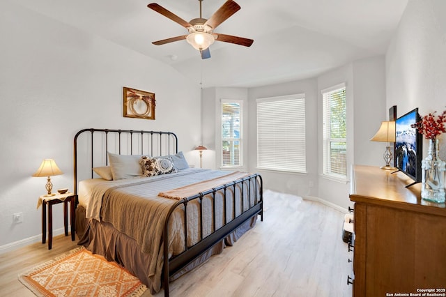 11706 Troubadour Trl, San Antonio, TX 78245 - bedroom featuring light wood finished floors, multiple windows, baseboards, vaulted ceiling, and a ceiling fan