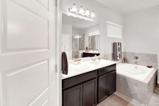 11706 Troubadour Trl, San Antonio, TX 78245 - full bath featuring a stall shower, a bath, vanity, and tile patterned flooring
