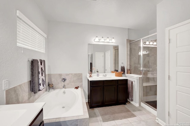 11706 Troubadour Trl, San Antonio, TX 78245 - bathroom with a shower stall, vanity, a garden tub, and tile patterned flooring