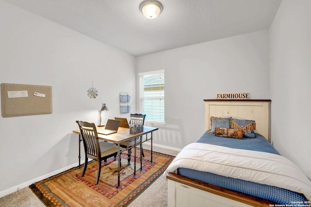 11706 Troubadour Trl, San Antonio, TX 78245 - bedroom featuring baseboards, a desk, and carpet flooring