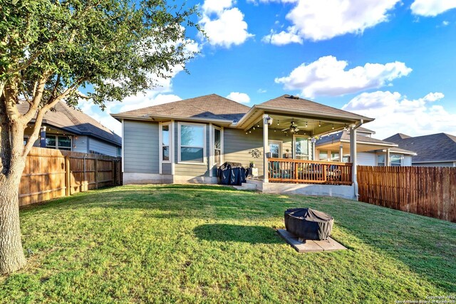 11706 Troubadour Trl, San Antonio, TX 78245 - rear view of house featuring ceiling fan and a fire pit