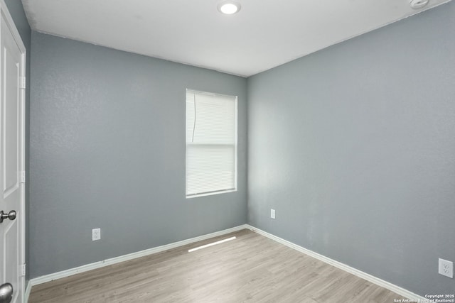 14418 Southton Basin, San Antonio, TX 78223 - unfurnished room featuring light wood-style flooring and baseboards