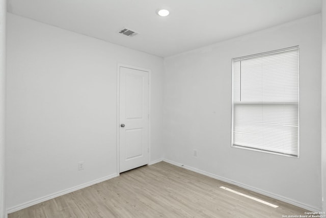 14418 Southton Basin, San Antonio, TX 78223 - unfurnished room featuring light wood-style flooring and baseboards