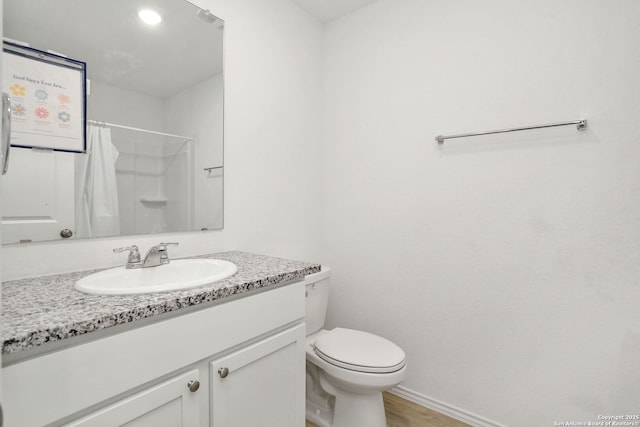 14418 Southton Basin, San Antonio, TX 78223 - bathroom with toilet, vanity, curtained shower, and wood finished floors