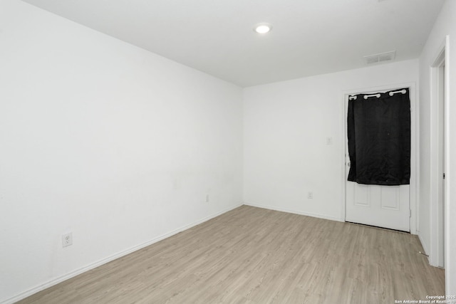 14418 Southton Basin, San Antonio, TX 78223 - spare room with light wood-type flooring, baseboards, and recessed lighting