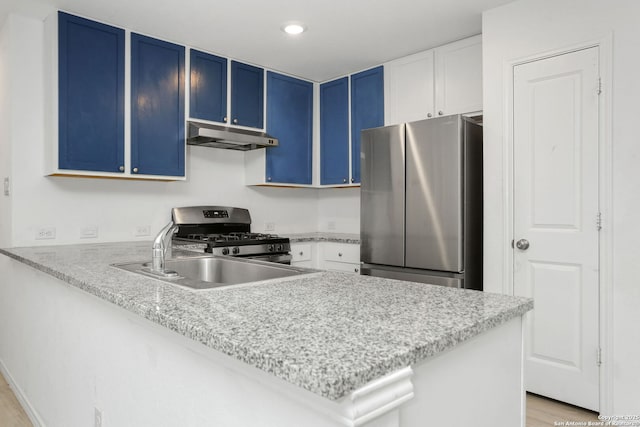 14418 Southton Basin, San Antonio, TX 78223 - kitchen featuring stainless steel appliances, blue cabinetry, under cabinet range hood, a peninsula, and a sink